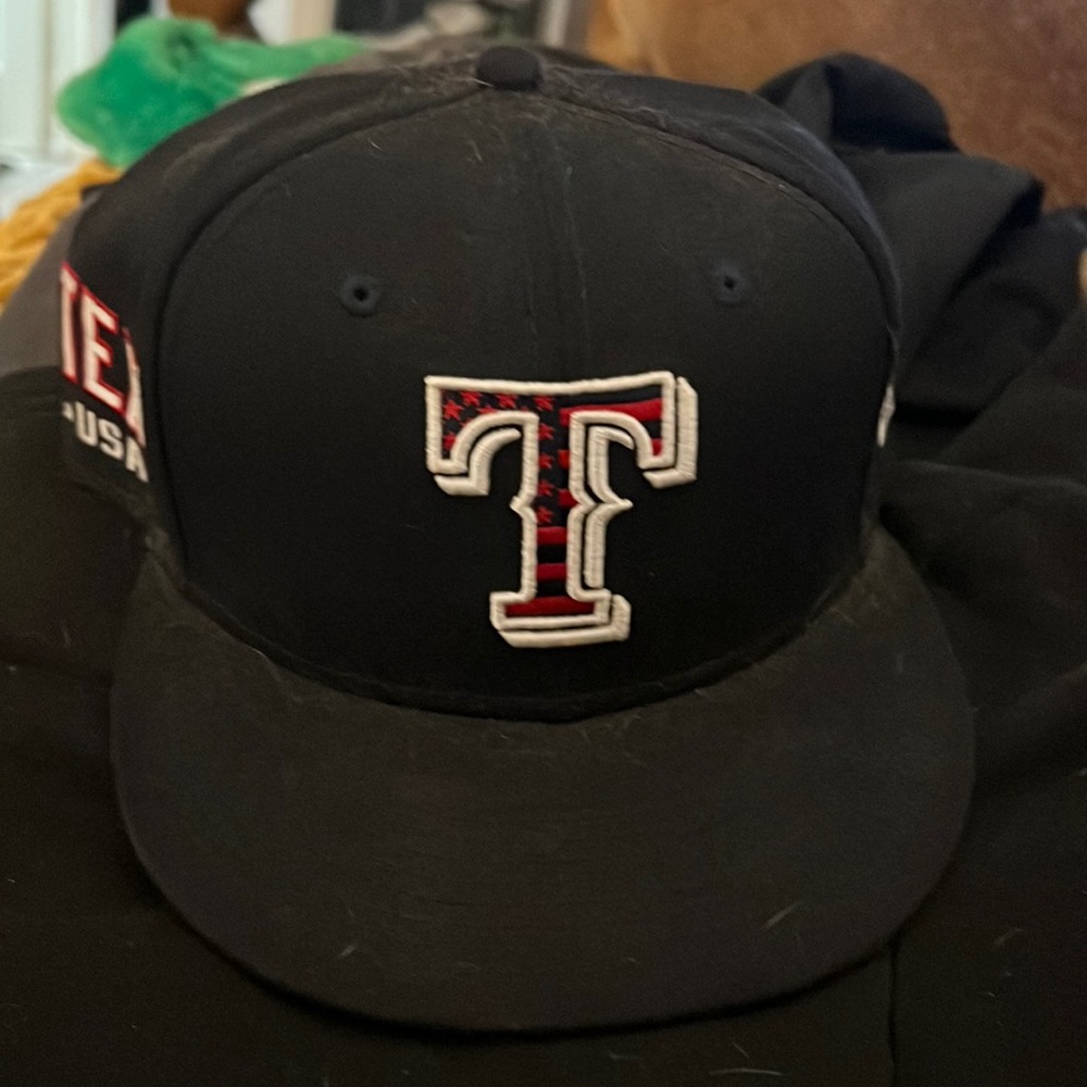 Navy blue and red Texas Rangers hat